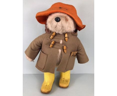 1970s Gabrielle Designs Paddington Bear with yellow Dunlop wellington boots, duffle coat and orange rain hat, with original l