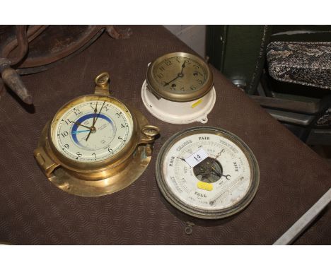 A brass cased ship's style saloon clock by Nauticalia; a smaller ship's style clock and a similar barometer