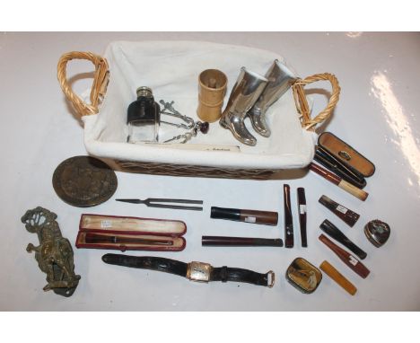 A basket containing 10K gold filled wrist watch; cigarette holders; brass door knocker; hip flask etc.