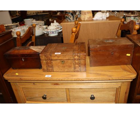 A mahogany sarcophagus shaped tea caddy; a walnut and inlaid writing box; and a mahogany tea caddy (missing interior)