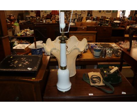 A white opaque glass and brass mounted table lamp and shade