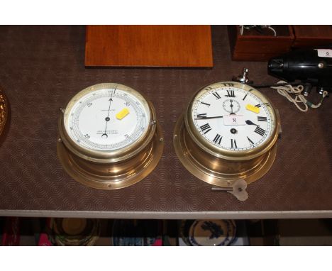 A ship's brass cased bulkhead clock and similar barometer by John Lilley & Son