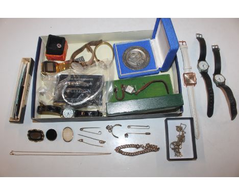 A box containing yellow metal dress ring; yellow metal mounted stick pins; a yellow metal mourning brooch; various other jewe