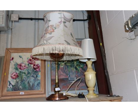 A brass and copper table lamp with floral decorated fringed shade and an onyx table lamp and shade