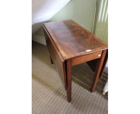 A 20th century Georgian design well figured mahogany twin flap dining table, on single gate leg action