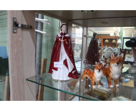 A Royal Worcester QEII 80th birthday figurine, together with two Royal Doulton Corgis 