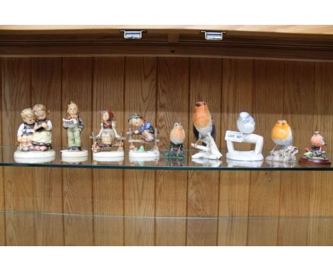 Four hand painted Goebel porcelain child figurines, together with five model birds 