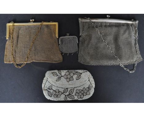 An assortment of early 20th century Edwardian era and later silver and white metal purses to include a hallmarked silver coin