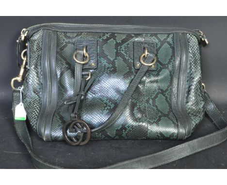 Gucci - A vintage 20th century Gucci green snakeskin handbag. The bag having clutch strap and shoulder strap with gold metal 