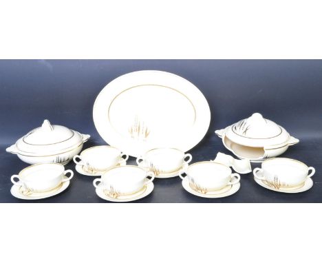 Clarice Cliff (A J Wilkinson Ltd) – A vintage Art Deco part dinner service with each piece having cream ground with gilt band
