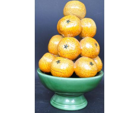 A retro vintage mid 20th century circa. 1950's Italian Majolica ceramic orange fruit bowl. The piece comprising of hand paint