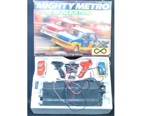 A vintage 20th century Mighty Metro Scalextric track and car set in box. With controls. Box measures 16cm x 37cm x 50cm.&nbsp