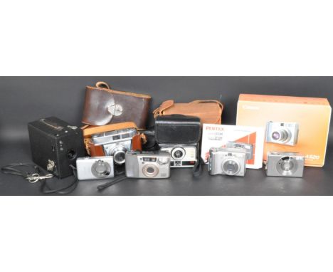 A collection of vintage 20th century cameras and photographic equipment to include a Kodak Instamatic 200, Kodak Retinette Co