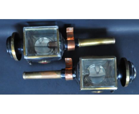 A pair of 19th century Victorian stagecoach carriage lamps. Each light having an ebonised metal body with brass fixtures and 