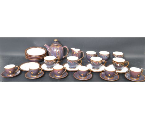 A vintage 20th Century stoneware coffee / tea service in Denby’s Shiraz pattern with purple ground and geometric patterns. Th