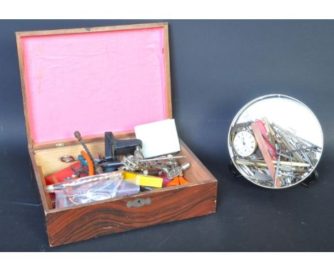 An assortment of 20th century tools to include watch tools files, scalpels, tweezers, scissors, clamps and more.&nbsp;