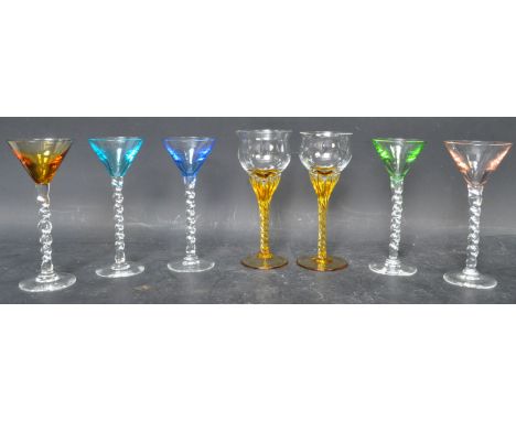An assortment of vintage mid 20th century italian style aperitif coloured blown glasses. The lot to include a couple of sherr