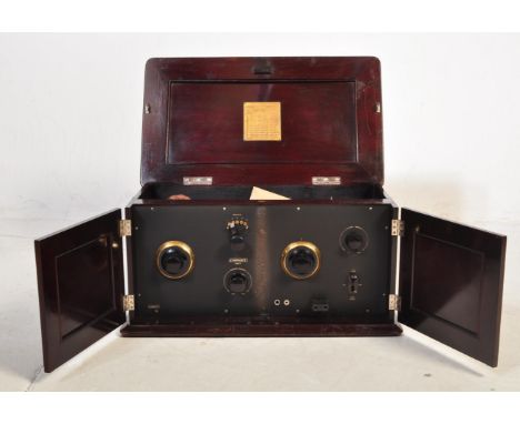 A retro vintage early 20th century (circa 1920s) official BBC burndept ethophone detector radio. It comes within a mahogany c