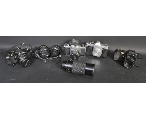 A collection of vintage 20th century Pentax camera bodies and lenses to include a Pentax Sirius MC Auto Zoom 1:3.9 f=80~200mm