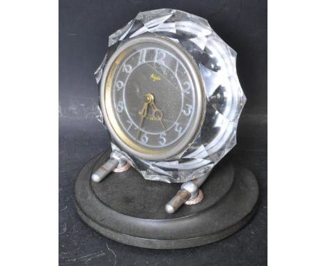 A retro vintage mid 20th century Russian Majak USSR desk clock. The clock having a metallic clock face with chrome Arabic num