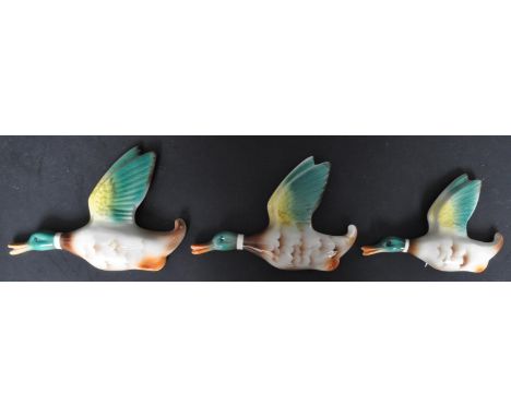 A collection of three vintage 20th century Beswick manner ceramic wall ducks with impressed marks to the back. Condition A/F.