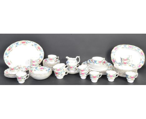 A vintage 20th century Royal Doulton bone china dinner and tea service in the Booths 'Floradora' pattern. Comprising of teacu