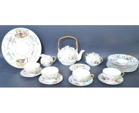 A vintage 20th century Japanese lithophane hand painted porcelain tea service comprising of teacups, saucers, teapots, sugar 