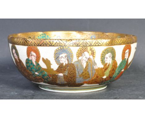 A 20th Century Japanese Satsuma ceramic bowl. The bowl being hand painted with a landscape scene depicting woman and children