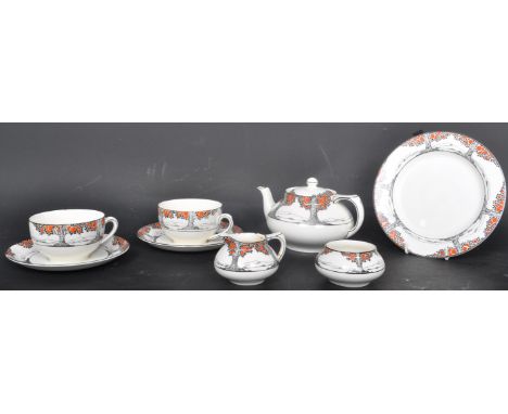 A Art Deco circa. 1920's Crown Ducal 'Orange Tree' pattern part tea service comprising of a teapot, a milk jug, saucers, tea 