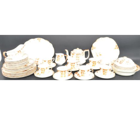 An Art Deco circa. 1930's china tea and dinner service comprising plates, bowls, gravy boat, teacups, teapot and saucers. Eac