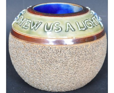 A 19th century Victorian Doulton Lambeth match strike of globular form having the phrase 'Shew us a Light' along the rim, tex