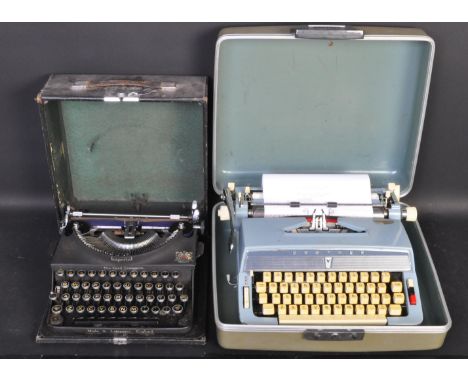 Two vintage retro mid 20th Century type writers. The lot to include a black cased DY 144 type writer and a Brother blue cased