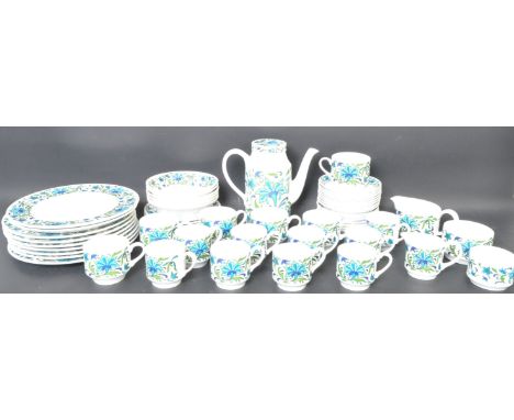A retro 20th Century dinner / coffee service by MidWinter in their Caprice pattern with each piece having blue floral decorat