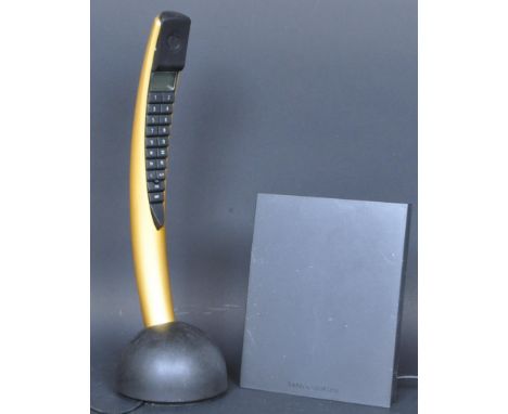 A retro late 20th century Bang &amp; Olufsen metallic yellow banana phone. Model "BeoCom 2", serial number 17888178. The lot 