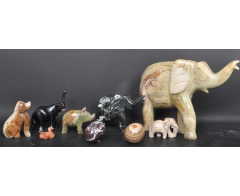 A collection of vintage 20th century alabaster and other animal figurines. The collection comprises of elephants, ducks rhino