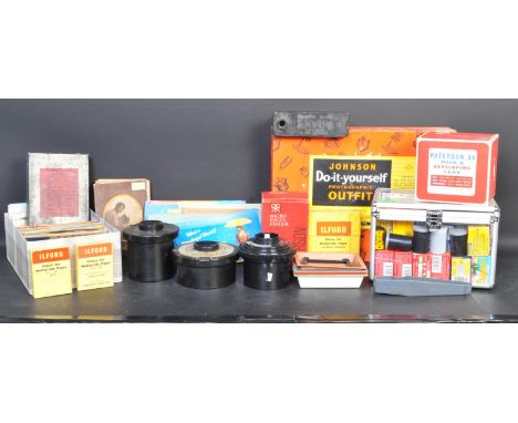 A collection of vintage 20th century photograhic equipment comprising of a 46 rolls of 35mm film, a large selection developin