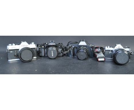 A collection of vintage 20th century camera bodies and lenses to include a Pentax MX body serial no. 9149122, a Sigma Zoom 1: