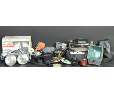 A collection of vintage film cameras and related equipment. The lot to include a Pentas ME Super camera with a Pentax-M 1:1.7