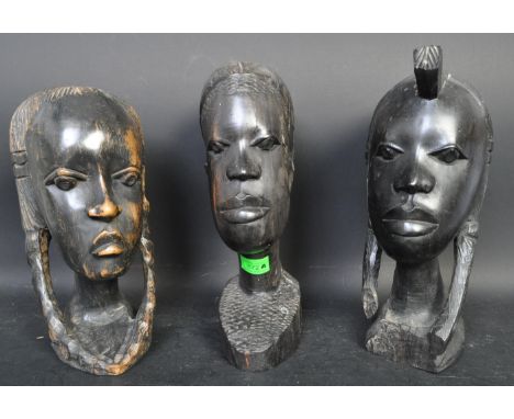 A collection of three vintage 20th century African carved wood bust sculptures to include two girls and a young man. Measures