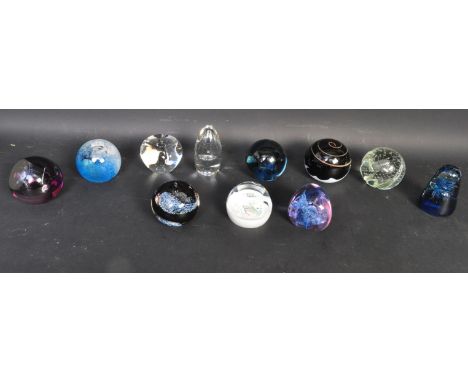 A large collection of vintage 20th century glass paperweights.&nbsp; Some limited edition examples. The majority being Caithn