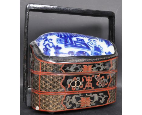 An early 20th century Chinese Bakul Siah three tier nuptial wedding basket hamper having hand painted black lacquer body with