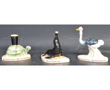 A collection three vintage 20th century Carlton Ware hand painted china ceramic Guinness figures to include an ostrich, seal 