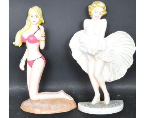 A pair of cast metal 20th century vintage style door stops. The polychrome doorstops are in the form of actresses Marilyn Mon