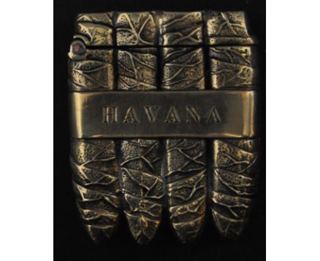 A vintage brass vesta case in the form of a pack Cuban of Havana cigars with Havana written to the body and match strike to t