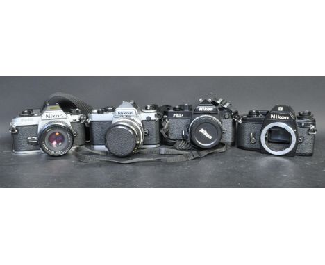 A collection of four vintage 20th century Nikon cameras and lenses to include a Nikon EM serial no. 7668112 (A/F), a Nikon FG