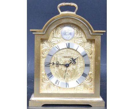 A vintage 20th century Swizal brass 15 jewels carriage clock. The clock having a chrome dial with black roman numeral to the 