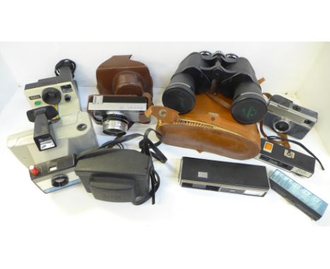 Two Polaroid land cameras, other cameras and a pair of binoculars 