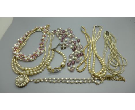 A collection of faux pearl necklaces 