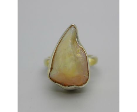 A silver gilt, rough cut fire opal ring, L 