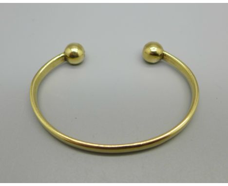 A hallmarked 9ct gold torque or torc bangle, 20.4g, (opening 25mm) 